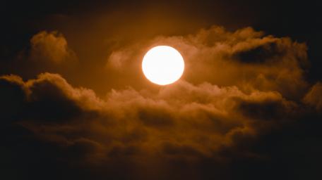 Clouds stalking the Sun wallpaper