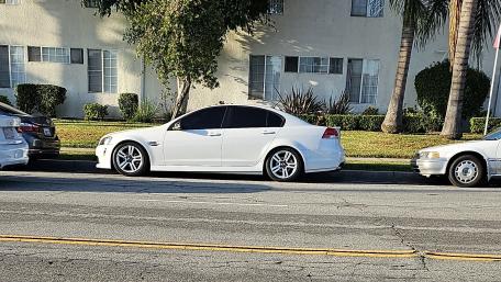 Sleek White Sedan Styled for the Street wallpaper