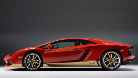 Stunning Lamborghini Aventador in Bold Red and Gold Finish wallpaper
