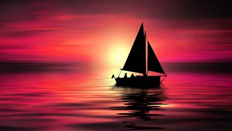 Sailboat Silhouette Against Sunset Glow wallpaper