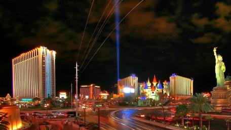 Vibrant Las Vegas Nightscape with Stunning Laser Show wallpaper