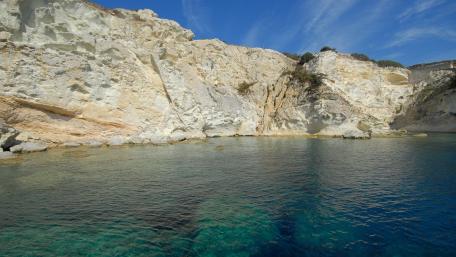 Serene Cliffside View Over Crystal Clear Sea wallpaper