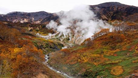 Autumn Valley Serenity with Steaming Creek wallpaper