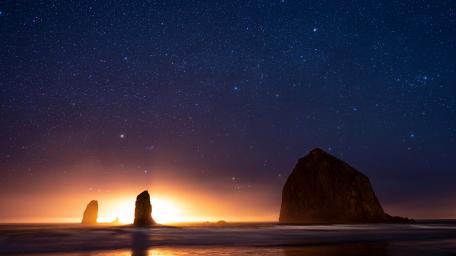 Haystack Rock under the starry sky wallpaper