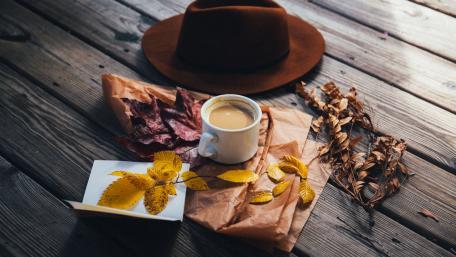 Warm Autumn Coffee Moment with Cozy Hat wallpaper