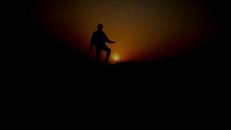 Silhouette Against a Dusk Sunset Moment wallpaper