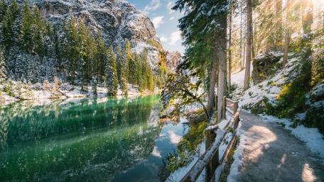 Winter's Embrace on a Serene Mountain Lake wallpaper
