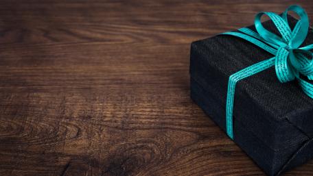 Mystery Gift on Wooden Backdrop wallpaper