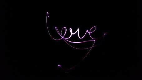 Luminous Love on a Dark Canvas wallpaper