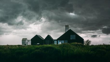 Moody Skies Over Solitary Homestead wallpaper