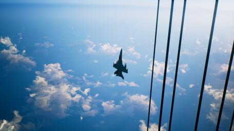 High-Speed Jet Above the Clouds wallpaper