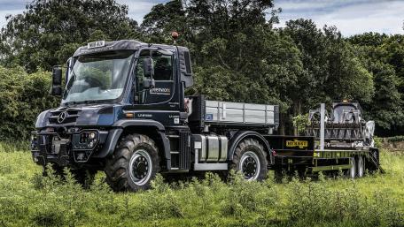 Rugged Mercedes Truck in Green Countryside wallpaper