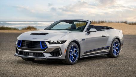 Sleek Convertible Ford Mustang Sports Car on Shoreline wallpaper