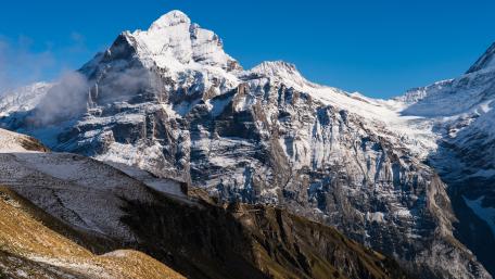 Majestic Mountain Peaks in Winter Glow wallpaper