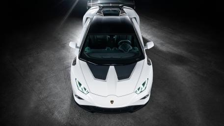 Sleek White Lamborghini Huracan Supercar Spotlight wallpaper