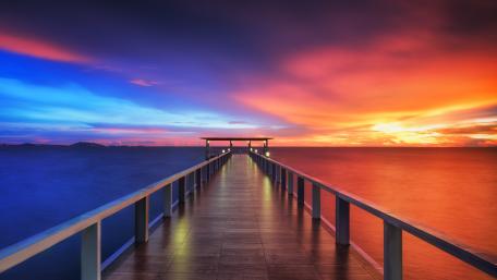 Vibrant Sunset Over a Serene Pier wallpaper