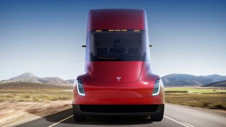Futuristic Tesla Truck on Open Road wallpaper