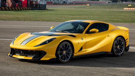 Sleek Yellow Sports Car on Track wallpaper