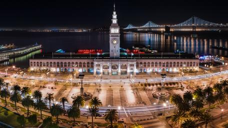 Illuminated Waterfront Promenade at Night in San Francisco wallpaper