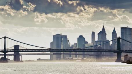 Sunlit Skyline Silhouette of the Manhattan Bridge wallpaper