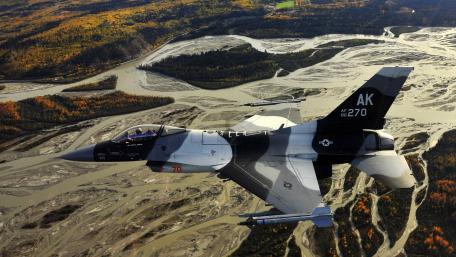 Majestic Flight Over Autumn Terrain wallpaper