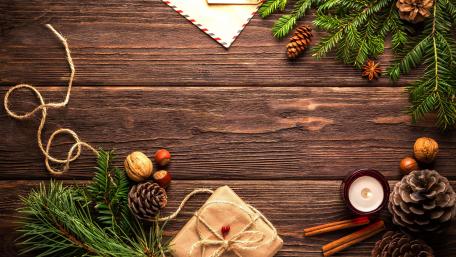 Rustic Christmas Table Decor with Ornaments and Greenery wallpaper
