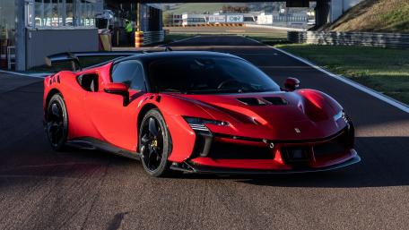 Red Ferrari SF90 XX Supercar On Track wallpaper