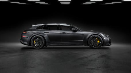 Sleek Black Porsche Panamera in Studio Setting wallpaper