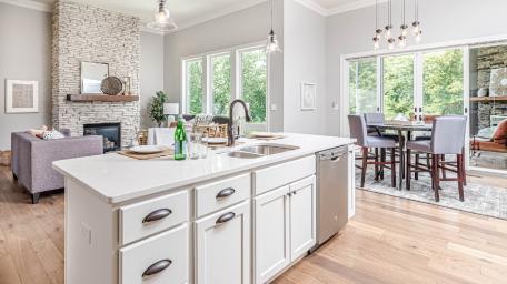 Modern Kitchen with Cozy Living Space and Natural Light wallpaper