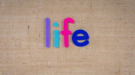 Vibrant Letters Celebrate the Essence of Life wallpaper