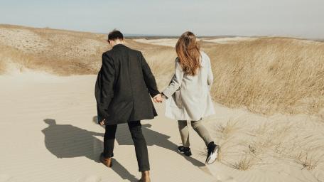 Hand in Hand on Sandy Shores wallpaper