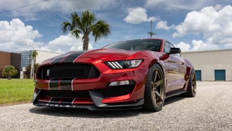 Sleek Shelby Mustang Underneath a Vibrant Sky wallpaper