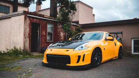 Sleek Yellow Nissan 370Z Sports Car Pride wallpaper