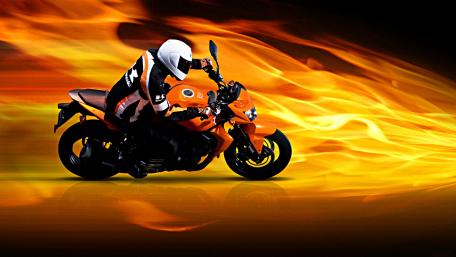 Fiery Motorcycle Ride Through Flames wallpaper