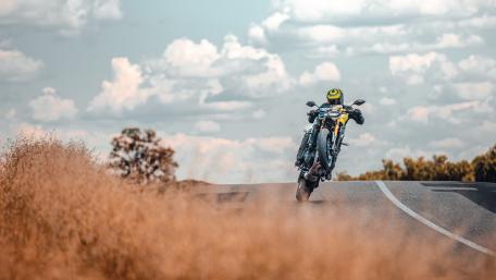 Thrilling Motorcycle Ride on Open Road wallpaper