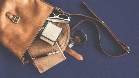 Chic Bag and Contents Displayed in Still Life Style wallpaper