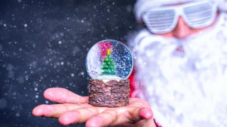 Enchanted Winter Globe Held by Santa wallpaper