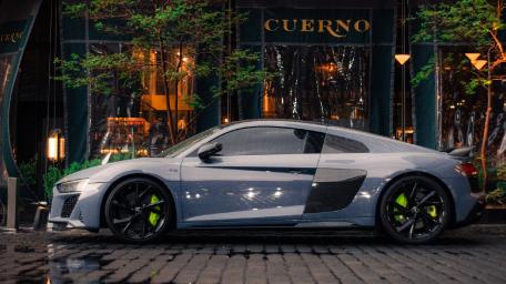 Sleek Audi R8 Captured in Rainy Night Vibes wallpaper