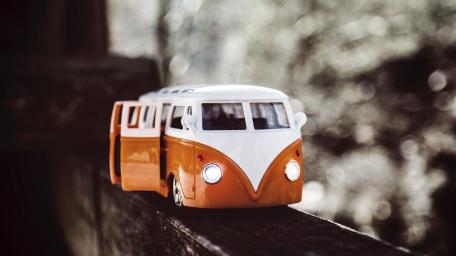 Vintage Toy Van on a Wooden Surface wallpaper