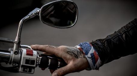 Rugged Motorcycle Grip with Tattoos and Style wallpaper