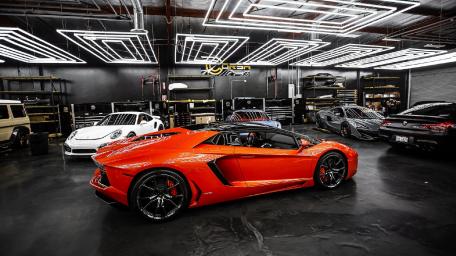 Vivid Lamborghini in Sleek Garage Scene wallpaper