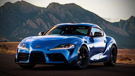 Toyota GR Supra in Front of Majestic Mountains wallpaper