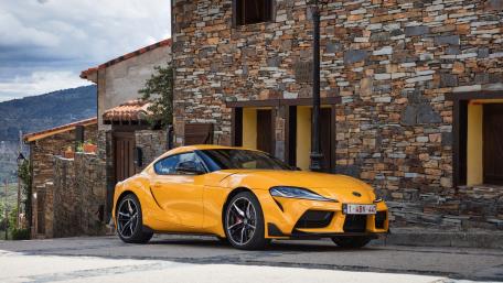Toyota GR SUPRA Outside Rustic Stone Building wallpaper