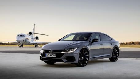 Volkswagen Arteon and Private Jet on Runway wallpaper