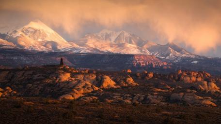 Golden Sunset Over Snow-Capped Mountains wallpaper