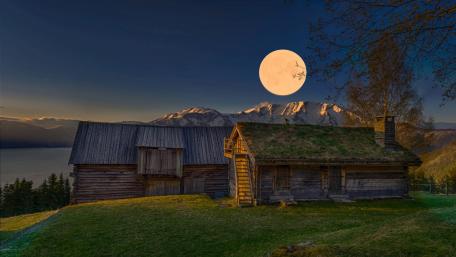 Mountain Refuge Under a Full Moon Glow wallpaper