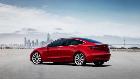 Sleek Red Tesla Model 3 by the Skyline wallpaper