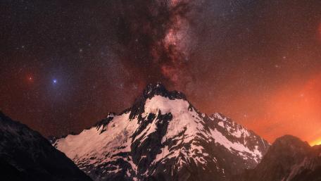 Majestic Milky Way Over Snowy Peak wallpaper