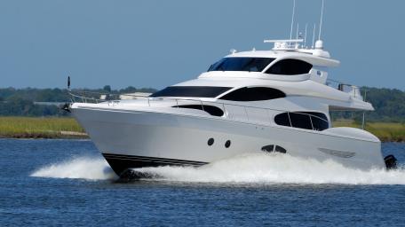 Luxurious Yacht Cutting Through Waves wallpaper