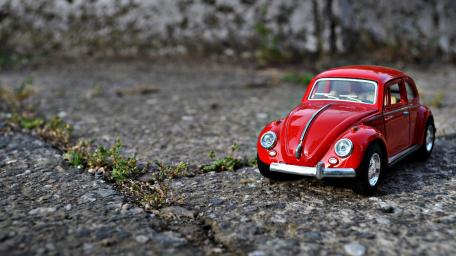 Classic Red Volkswagen Beetle Toy Car Wallpaper wallpaper